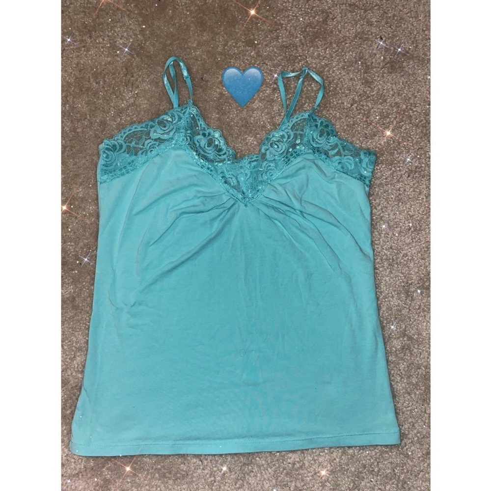 Cute blue Tanktop with adjustable straps and lace edging at the top.